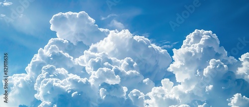 Large white clouds against a blue sky background. A Majestic Display of White Clouds