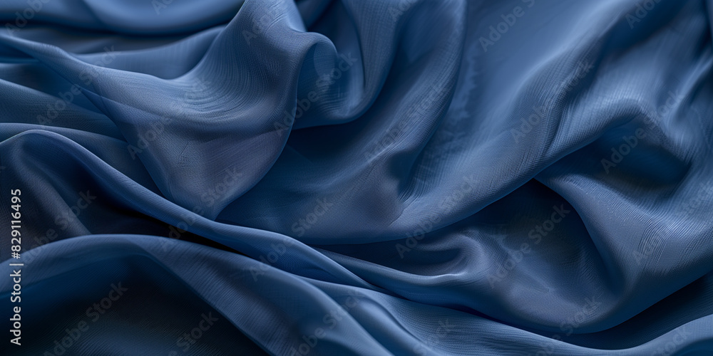 Blue fabric with delicate folds. Silk satin fabric backdrop with copy space. Blue fabric with delicate folds. Silk satin fabric backdrop with copy space.