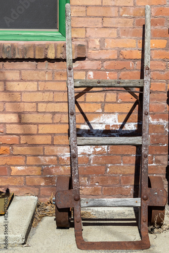 An old wooden and rusted hand truck