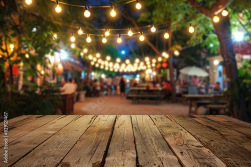 Summer Market. Wooden Table with Festive Outdoor String Lights, Blurred People. Perfect for Montage Display