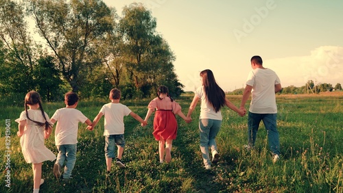 Family, mom, dad, children, play together on weekends outdoors. Kids, parents run in park, friends play in summer. Happy childhood dream, Concept. Happy boy girl run, play together, nature. Friends