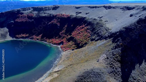 Aerial view of the Batea Mahuida Volcano with a lagoon in its crater located in Villa Pehuenia photo
