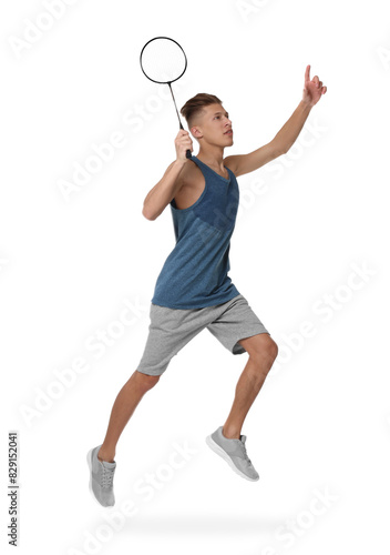 Young man playing badminton with racket on white background © New Africa