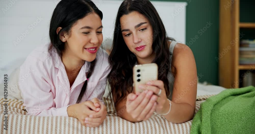 Smartphone, women and happy couple of friends on bed for social media, relax or funny meme together in home. Girls, smile and phone in bedroom on internet for online shopping, gossip or talking Smartphone, women and happy couple of friends on bed for social media, relax or funny meme together in home. Girls, smile and phone in bedroom on internet for online shopping, gossip or talking