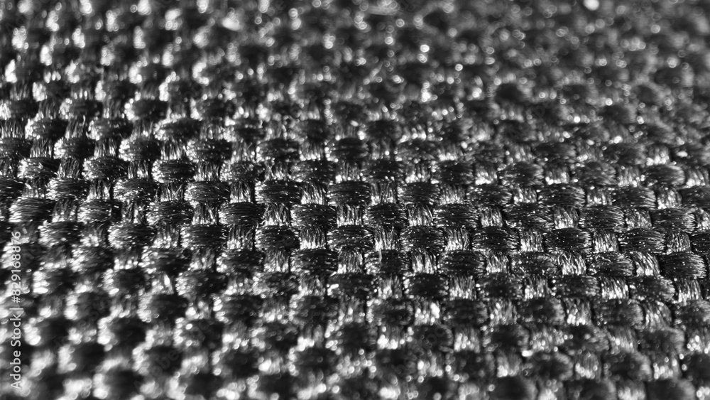 Behold the elegance of black polyester fabric, boasting a refined woven pattern. Its subtle gleam and meticulous weave exude modern sophistication, ideal for diverse uses.
Behold the elegance of black polyester fabric, boasting a refined woven pattern. Its subtle gleam and meticulous weave exude modern sophistication, ideal for diverse uses.