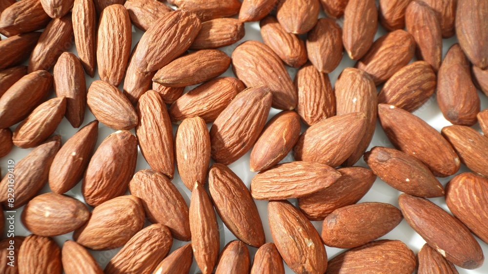 Fototapeta premium Discover the culinary magic of raw almonds. Whether roasted, ground into flour, or blended into milk, they infuse dishes with rich flavor and wholesome nutrition.