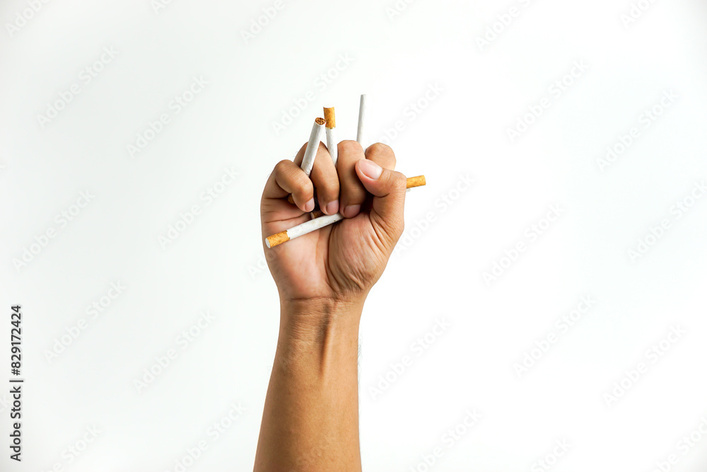 man's hand destroys cigarette isolated on white, smoking cessation concept, World No Tobacco Day man's hand destroys cigarette isolated on white, smoking cessation concept, World No Tobacco Day