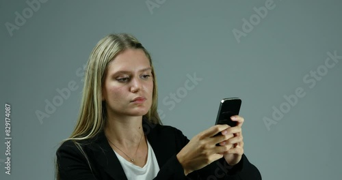 Smartphone stops, frustrated woman gesticulates uncontrollably