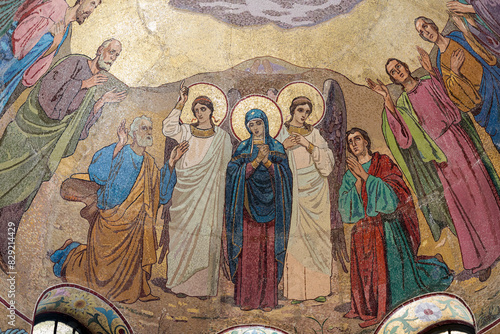 Virgin Mary surrounded by angels and saints