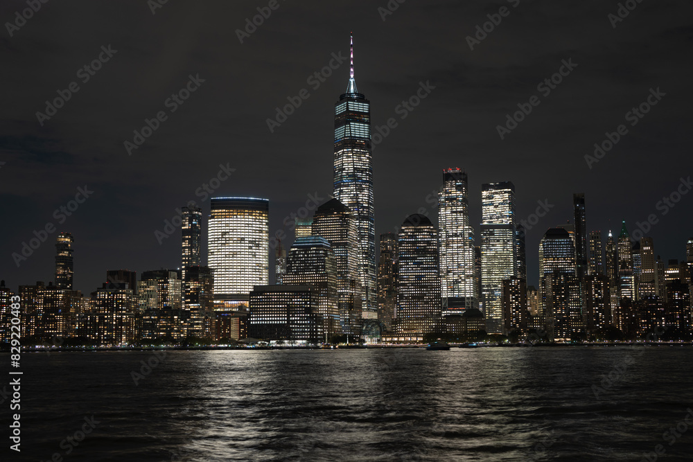 Night in The NYC city, USA, United States. Night day with iconic buildings. New York City NYC Manhattan Downtown Skyline, viewed from Jersey City, USA.