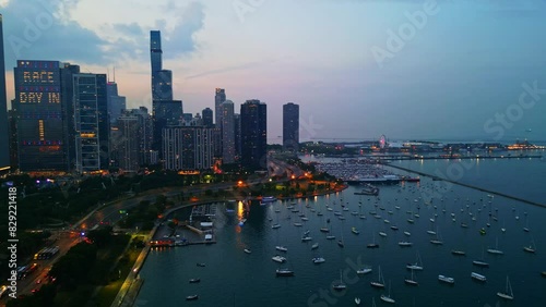 Drone shot of the beautiful harbor on Lake Michigan and of Chicago's Millennium Park, filmed at sunset. photo