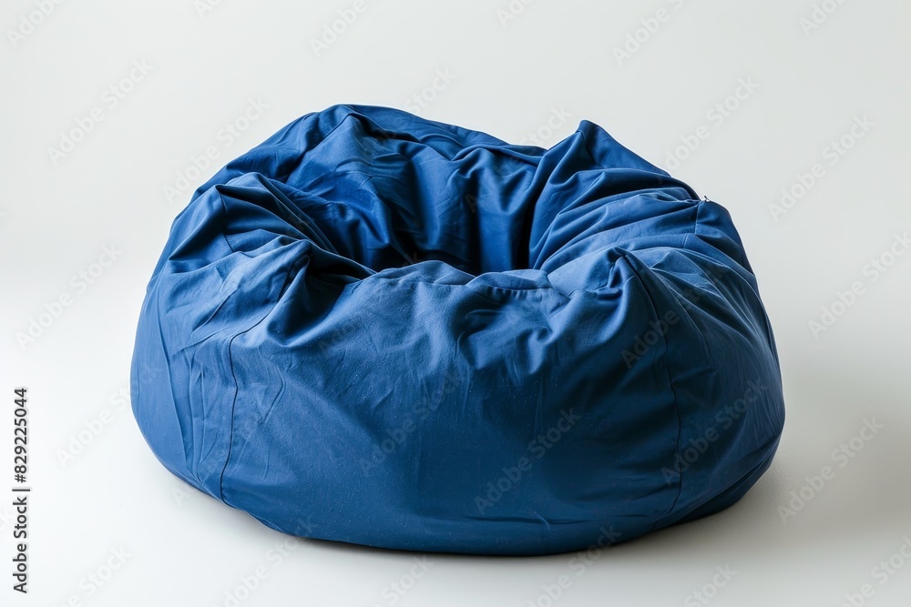 Blue bean bag against white surface Blue bean bag against white surface