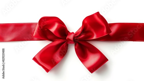 Festive red ribbon tied in a perfect bow on a white background.