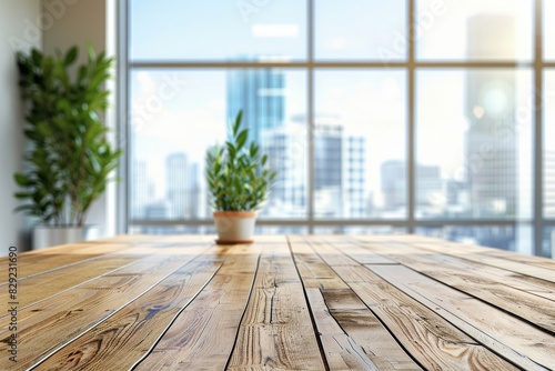 Empty wooden office desk with large window background close up mock up