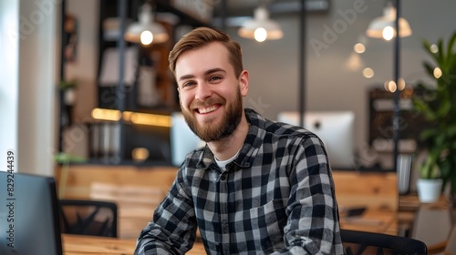 Cheerful Young Professional Enjoys Work in Stylish Office Environment