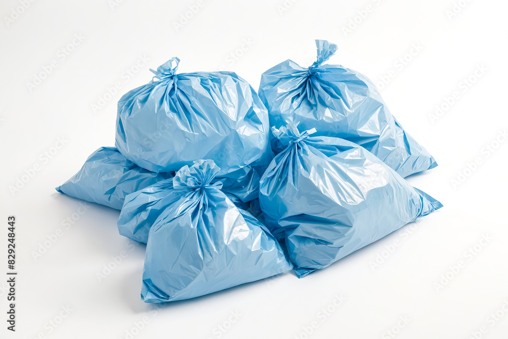 Close-up of Blue Plastic Garbage Bags on White Background Close-up of Blue Plastic Garbage Bags on White Background