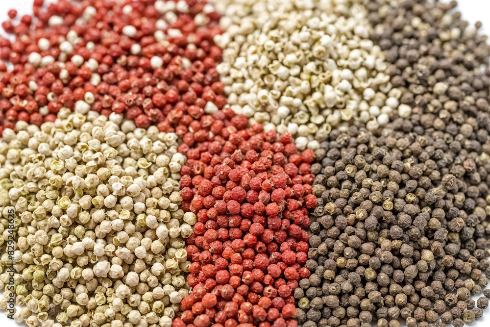 Fototapeta premium Close up of four different types of peppercorns
