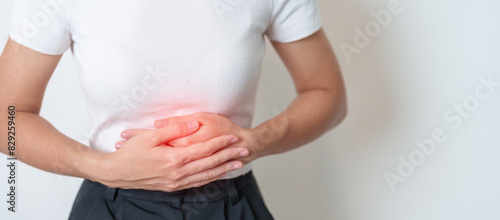 Woman having Stomach pain. Ovarian and Cervical cancer, Cervix disorder, Endometriosis, Hysterectomy, Uterine fibroids, Reproductive system, menstruation, diarrhea, digestive system and Pregnancy photo