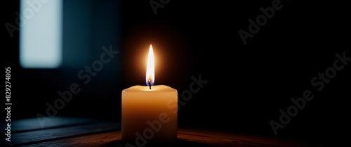 Horror Single flickering candle in a dark room