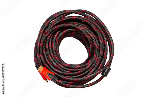 The coil of HDMI cable isolated on white background. Red-black cable for connecting multimedia devices.