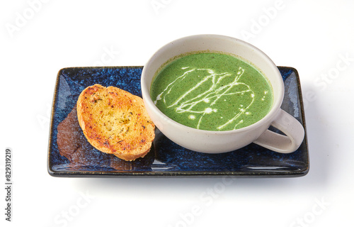 Creamy Spinach Soup with Garlic Butter Bread (crouton) isolated on white background.