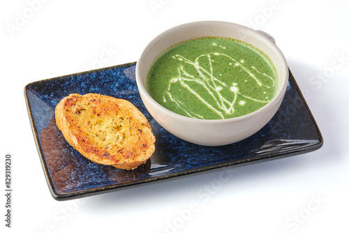 Creamy Spinach Soup with Garlic Butter Bread (crouton) isolated on white background.