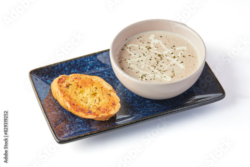 Creamy Mushroom Soup with Garlic Butter Bread (crouton) isolated on white background.
