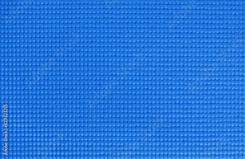 Blue yoga mat texture, pattern of rubber for background.