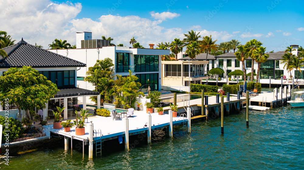 Fototapeta premium Vacation in summer paradise. Luxury resort at summertime. Travel to tropical bay of Florida. Summer vacation in tropical paradise resort. Luxury summer villa with yacht pier. Luxurious escape