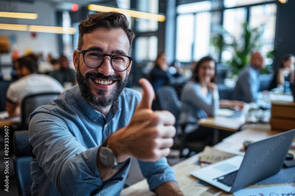 Caucasian middle-aged man in an office, giving a thumbs up, smiling, wearing glasses. Caucasian middle-aged man in an office, giving a thumbs up, smiling, wearing glasses.