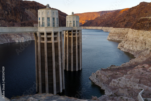 Hoover Dam intake towers and Lake Meade reservoir shown at dusk. Recent image taken in mid-March, 2024.