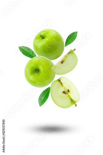 Flying group green apple with slices and green leaf isolated on white background.