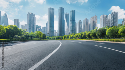 Modern city buildings rise against the sky  with a pristine asphalt road curving gracefully through the urban expanse.