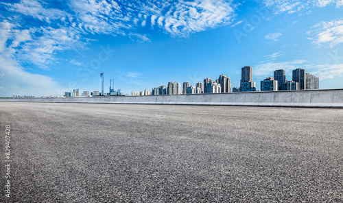 Empty asphalt road and modern city skyline in Suzhou