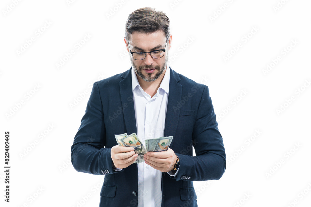 Man with money cash. Dollar banknotes. Portrait of businessman holding money banknotes. Dollar bills, credit, online banking. Rich man pointing at dollar banknotes, bank loan, financial savings. Man with money cash. Dollar banknotes. Portrait of businessman holding money banknotes. Dollar bills, credit, online banking. Rich man pointing at dollar banknotes, bank loan, financial savings.