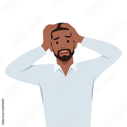 Shocked/amazed young business man holding hands on head and keeping mouth open. Headache pain or stress. Human emotions, facial expressions