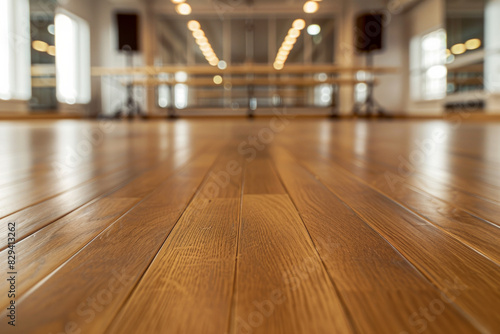 Wallpaper Mural A wooden dance floor in the foreground with a blurred background of a dance studio. The background includes mirrors covering the walls. Torontodigital.ca