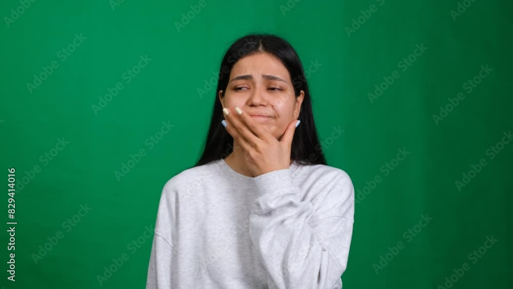 Facepalm of disappointment. Woman in a studio shot displays a gesture of confusion and shame, capturing the emotion of making a mistake and facing trouble with a sense of loss Facepalm of disappointment. Woman in a studio shot displays a gesture of confusion and shame, capturing the emotion of making a mistake and facing trouble with a sense of loss