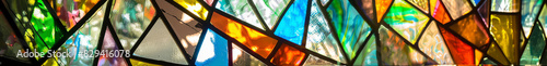 StainedGlass Window with an Abstract Design of Vibrant Colors photo