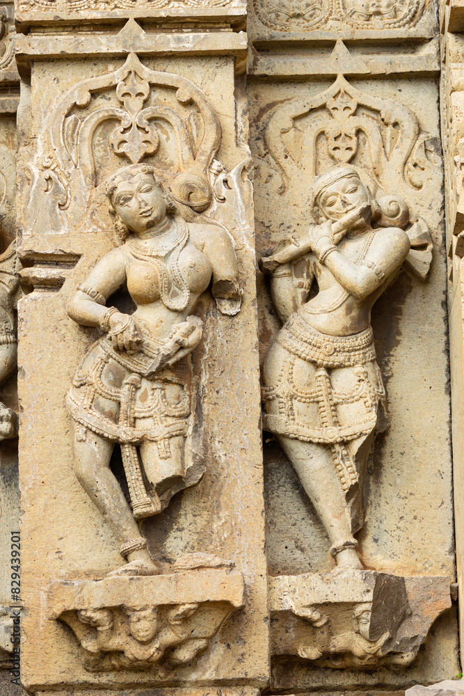 Sculpture of Lord Krishna and Dancing Women on the Kedareshwara Temple, Dharmapuri, Beed Maharashtra India.
