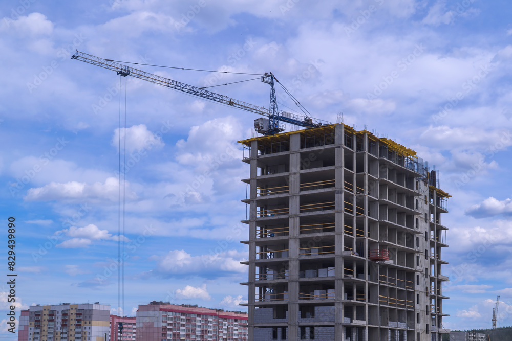 Construction tower crane on a construction site. Construction tower crane on a construction site.