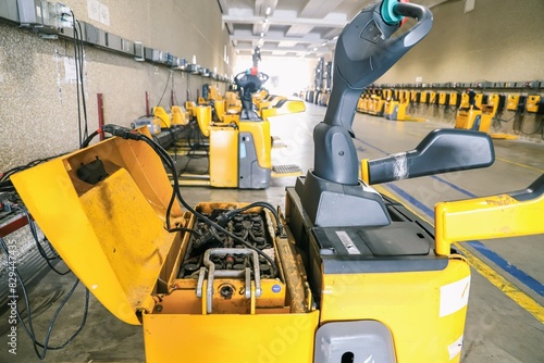 forklift truck in warehouse . forklift charging room - close-up of forklifts being recharged photo