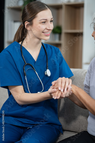 young caregiver assists her elderly woman patient at a nursing home. senior woman is assisted by a nurse at home.