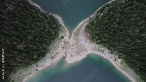 Aerial video, Crno Jezero or Black Lake, pine forest and cliffs in Dormitor National Park, Zabljak photo