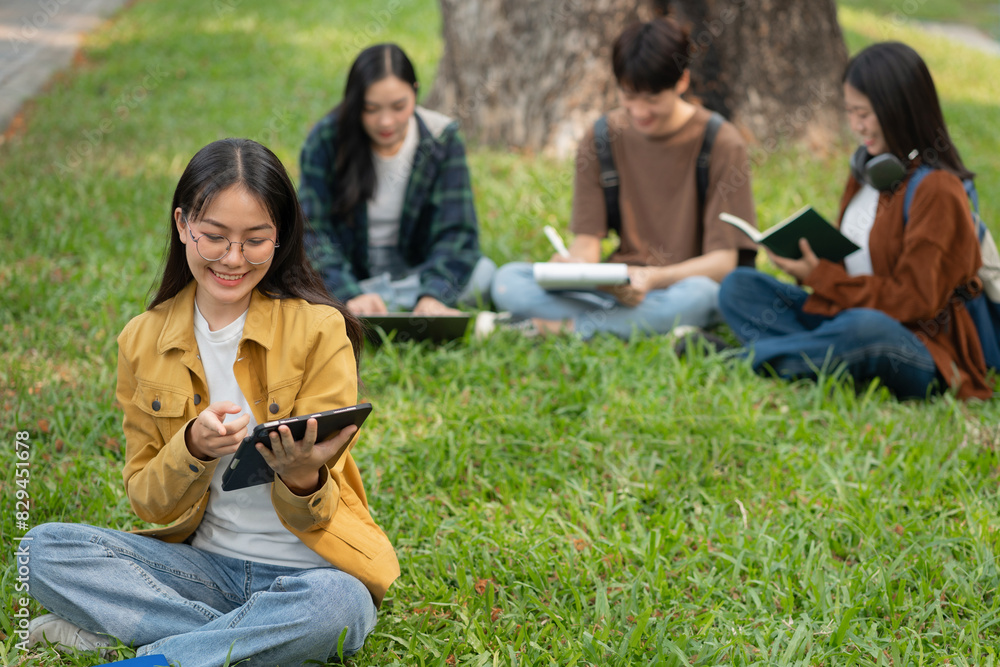 Group of students with books preparing for exams during holidays. Group of students with books preparing for exams during holidays.