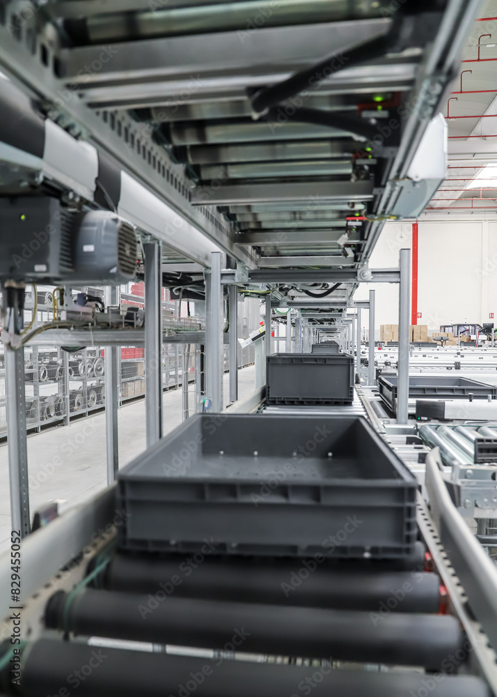 Obraz premium packing line in a logistics warehouse. 