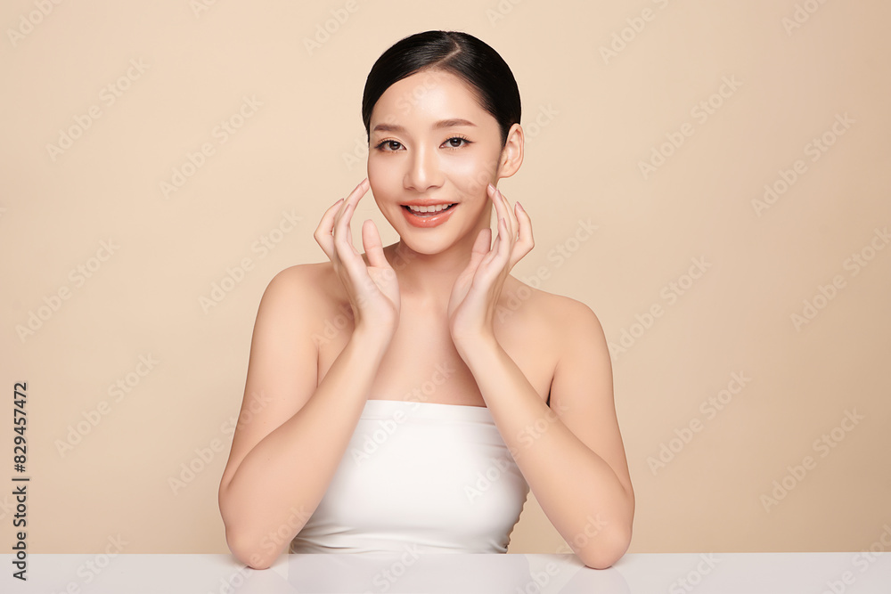 Beautiful young asian woman with clean fresh skin on beige background, Face care, Facial treatment, Cosmetology, beauty and spa, Asian women portrait. Beautiful young asian woman with clean fresh skin on beige background, Face care, Facial treatment, Cosmetology, beauty and spa, Asian women portrait.