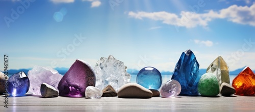 Crystal and gemstones depicted in a copy space image promoting health wellness and healing against a natural backdrop photo