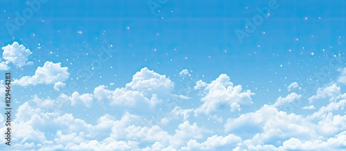 A decorative summer themed background pattern featuring a bright blue sky dotted with small white clouds perfect for adding text in the empty space. Copyspace image