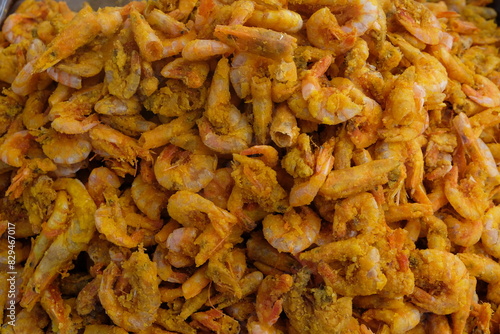 Delicious fried sea prawns on a container. Shrimp or prawns is a variety of seafood. Indonesian food.